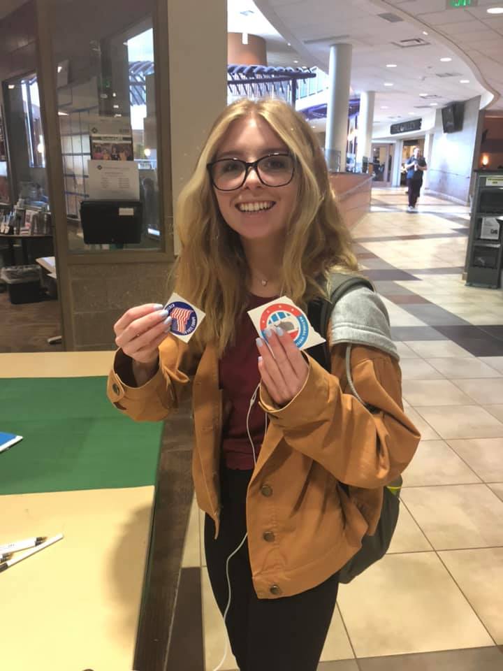 OCC student holding an I voted sticker